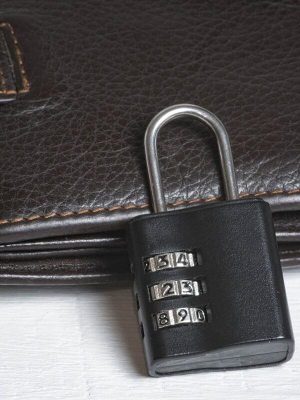 Leather wallet with a combination lock. Safe storage of money. Financial security